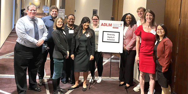 Photo of the 2023-24 ADLM Diversity, Equity, and Inclusion Steering Committee (with ADLM President, Octavia Peck Palmer and missing Chair, Christina Pierre)