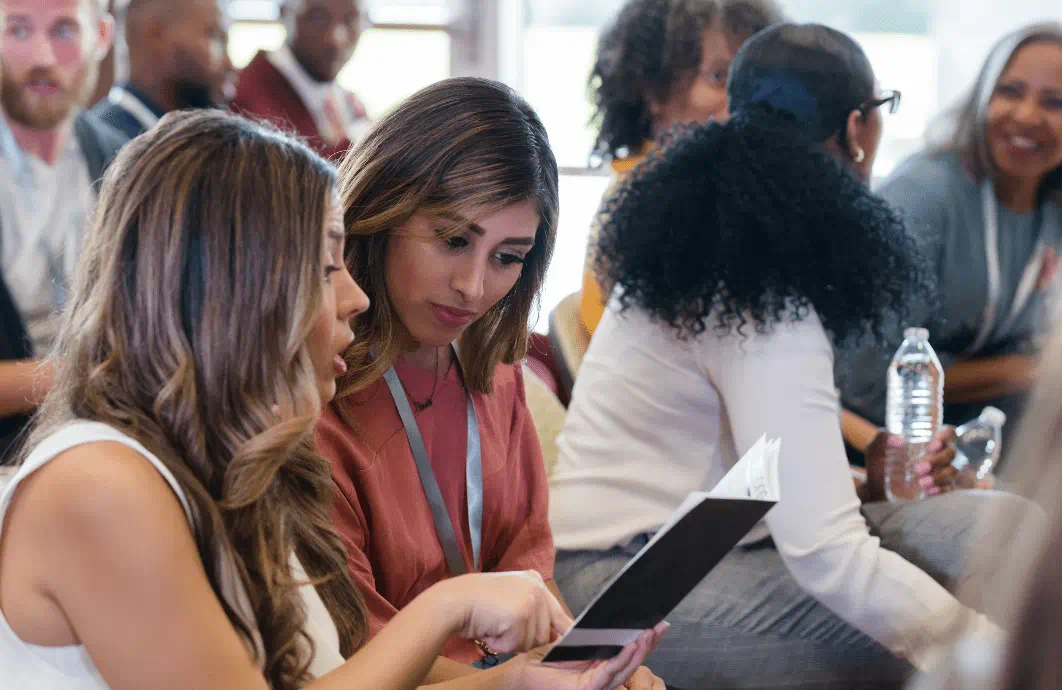 People looking at a program