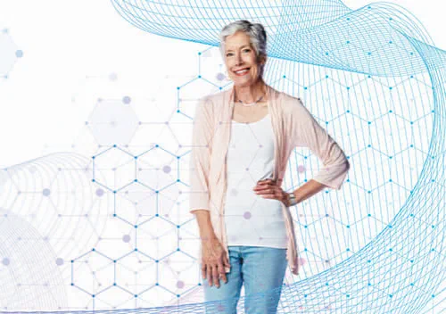 An elderly woman posing with one hand on her hip